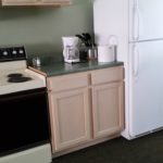 Electric range, furnished kitchen